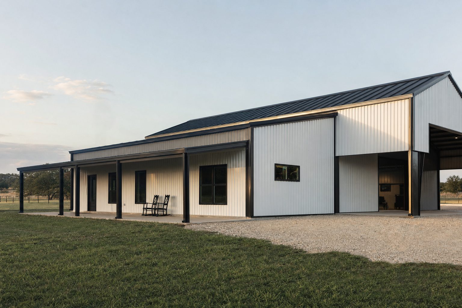 White metal building with black standing-seam roof in the Texas Hill Country