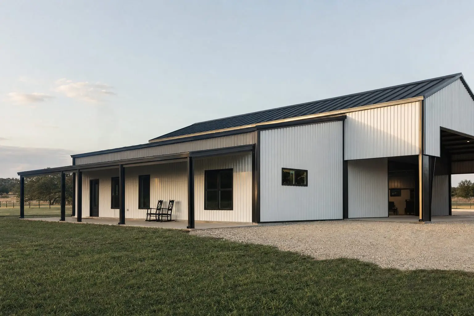 White metal building with black standing-seam roof in the Texas Hill Country